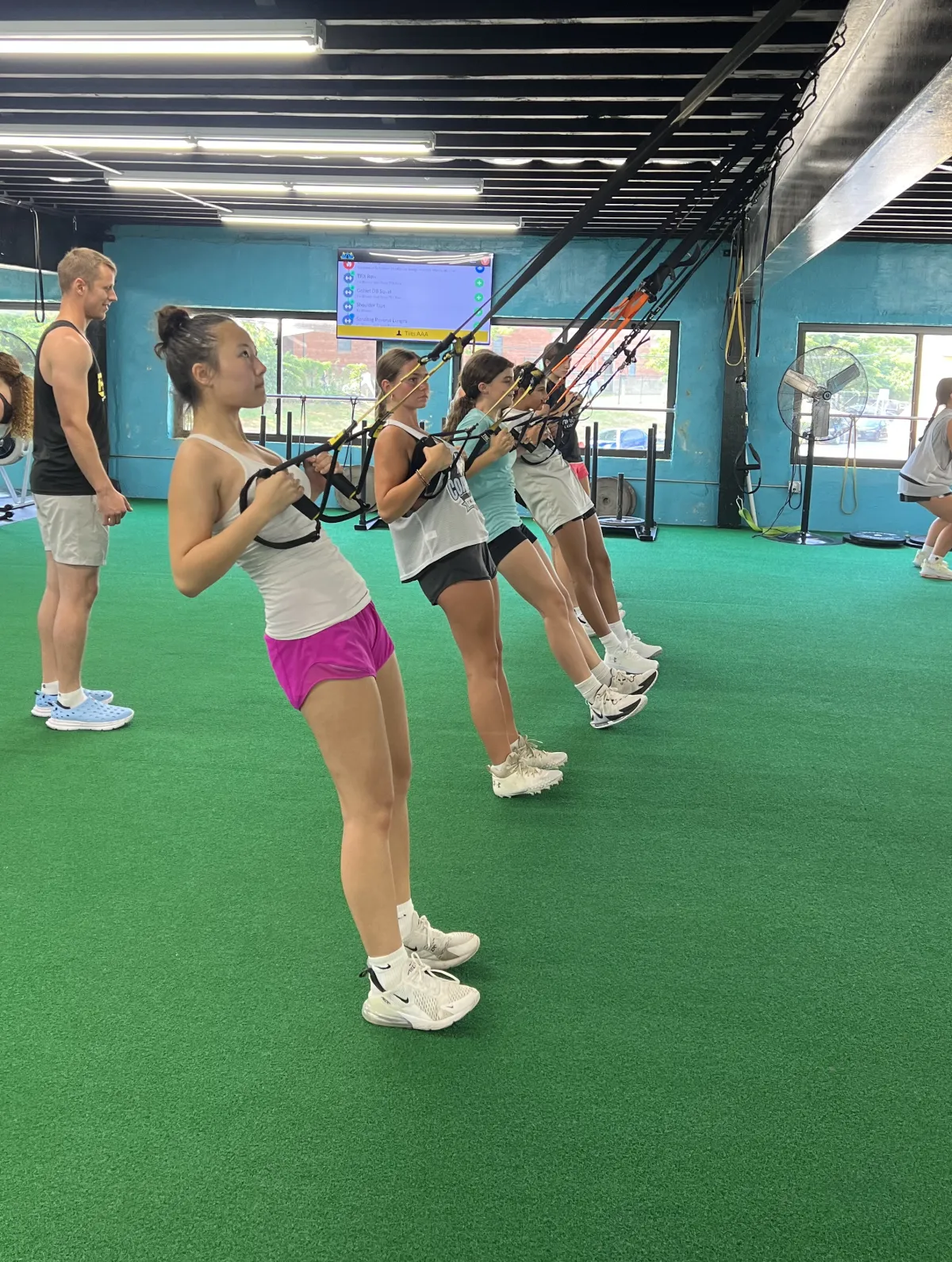 LI Thunder Softball athletes training on TRX straps at RAF
